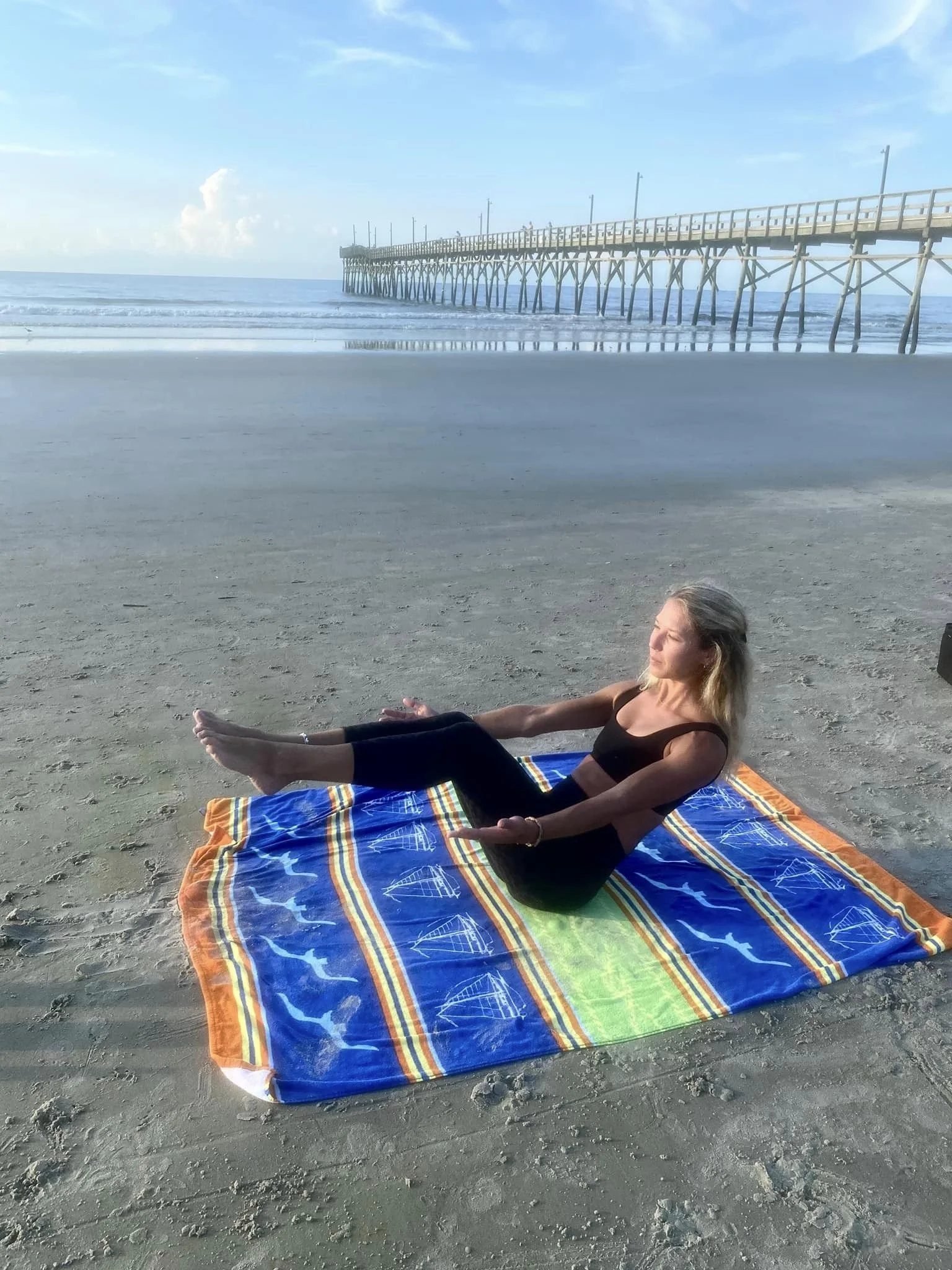Pilates on the beach by the pier