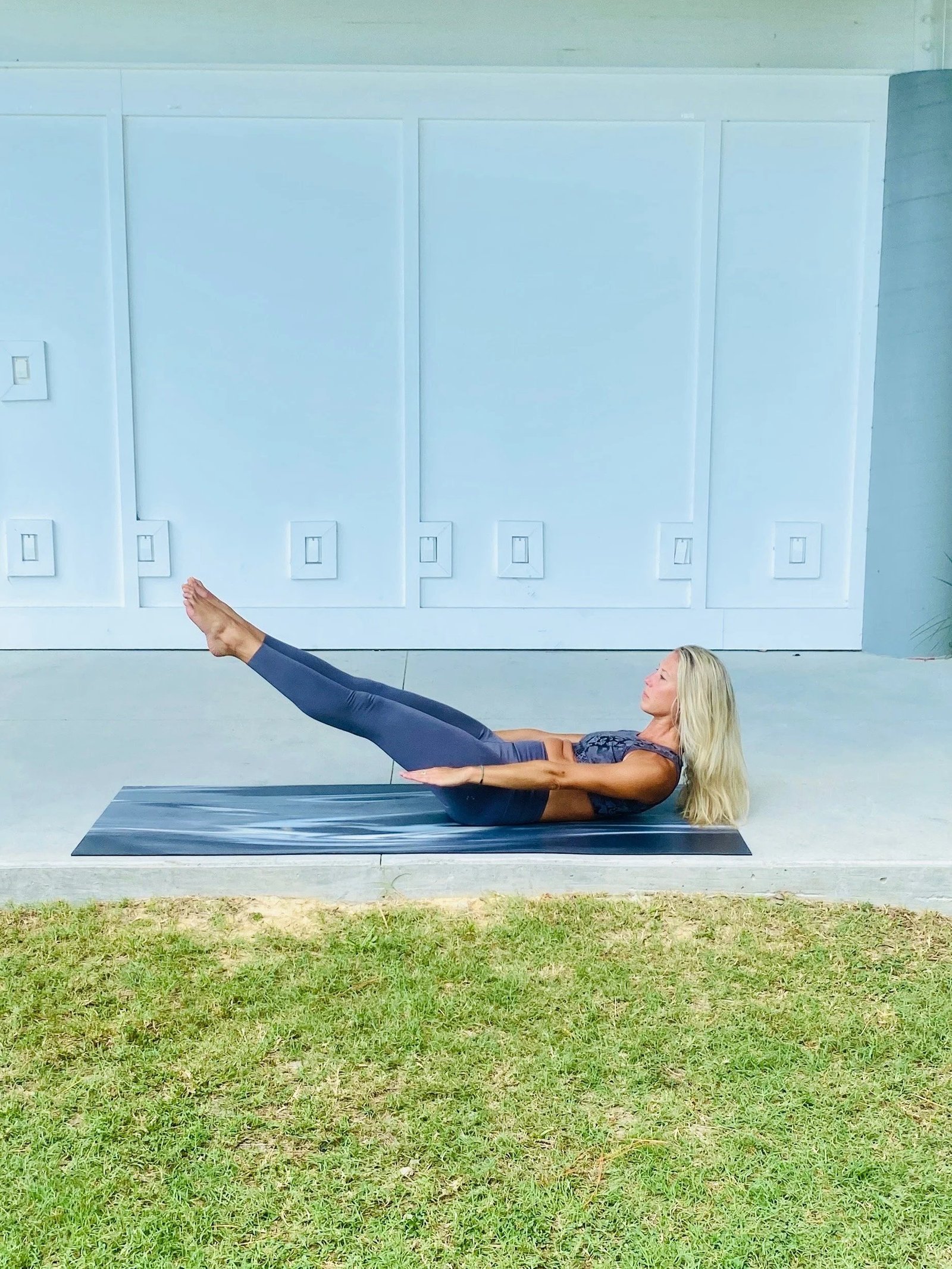 Kimberly holding a teaser on the mat